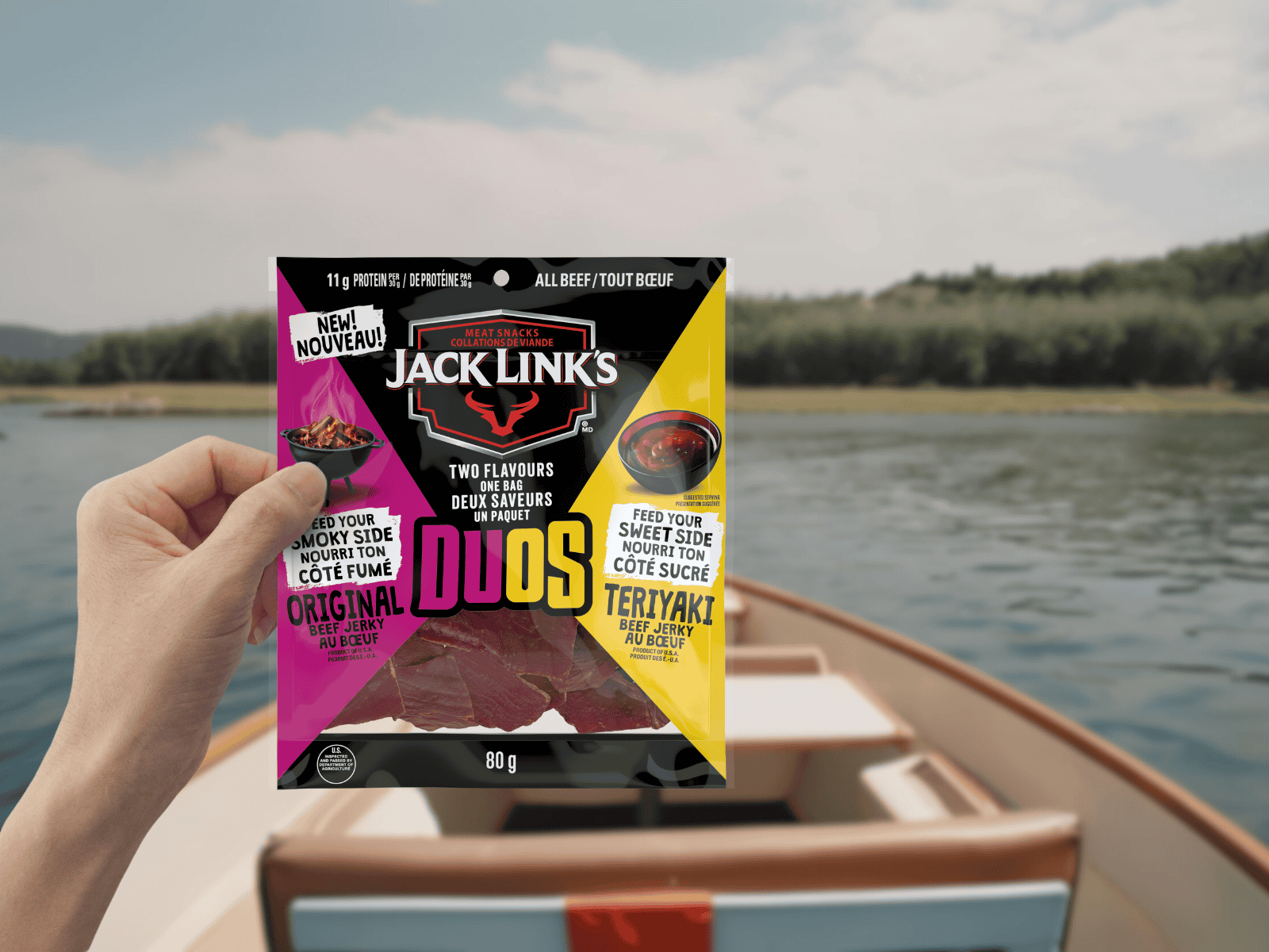 Jack Link's Duos Original and Teriyaki Beef Jerky in front of a boating scene.